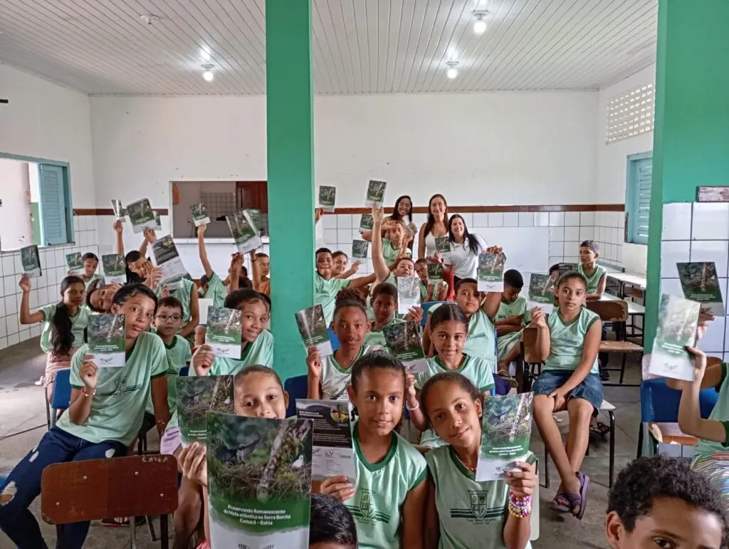 Photo of a classroom filled with children participating in an ecological lesson put on by Serra Bonita reserve, Brazil